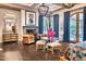 Luxurious bedroom featuring a fireplace, hardwood floors, and access to a private patio at 6240 N 59Th Pl, Paradise Valley, AZ 85253