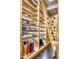 Custom shoe and boot storage with a wooden ladder for access at 6240 N 59Th Pl, Paradise Valley, AZ 85253