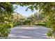 Landscaped courtyard with an archway and olive trees at 6240 N 59Th Pl, Paradise Valley, AZ 85253