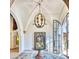 Grand entryway with high ceilings, a unique light fixture, and modern art at 6240 N 59Th Pl, Paradise Valley, AZ 85253