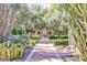 Landscaped garden path leading to a stone structure and seating area at 6240 N 59Th Pl, Paradise Valley, AZ 85253