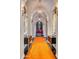 Elegant hallway with arched ceilings, a long orange runner, and statement art at 6240 N 59Th Pl, Paradise Valley, AZ 85253