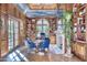Elegant library with built-in bookshelves and fireplace at 6240 N 59Th Pl, Paradise Valley, AZ 85253