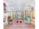 Spacious living room with a fireplace, large windows, and eclectic furnishings at 6240 N 59Th Pl, Paradise Valley, AZ 85253