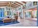 Bright living room featuring high ceilings, exposed beams, and a stylish sectional sofa at 6240 N 59Th Pl, Paradise Valley, AZ 85253