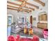 Open living room with high ceilings, exposed beams, and comfortable seating at 6240 N 59Th Pl, Paradise Valley, AZ 85253