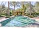 Long rectangular pool surrounded by palm trees at 6240 N 59Th Pl, Paradise Valley, AZ 85253