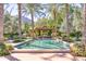 Resort-style pool with a pergola and lush landscaping at 6240 N 59Th Pl, Paradise Valley, AZ 85253