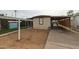 Front exterior of a manufactured home with a carport and a for sale sign at 625 W Mckellips Rd # 161, Mesa, AZ 85201