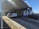 Carport with gray siding and paved parking area at 650 N Hawes Rd # 3729, Mesa, AZ 85207