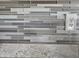 Kitchen backsplash with multi-colored glass tiles at 650 N Hawes Rd # 3729, Mesa, AZ 85207