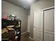 Room with built-in shelving and double door closet at 650 N Hawes Rd # 3729, Mesa, AZ 85207