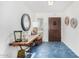 Bright and airy entryway with hexagonal tile flooring and rustic wood console table at 7332 E Montebello Ave, Scottsdale, AZ 85250