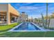 Luxury pool and spa with artificial turf and desert landscaping at 8300 E Dixileta Dr # 279, Scottsdale, AZ 85266