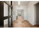 Grand entryway with hardwood floors and modern chandelier at 8565 E Arroyo Seco Rd, Scottsdale, AZ 85266