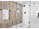 Walk-in shower with wood-look tile and glass enclosure at 1005 E Stirrup Ln, San Tan Valley, AZ 85143