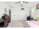 Well-lit bedroom with double door closet and desk area at 10254 W Piccadilly Rd, Avondale, AZ 85392