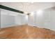 Dining room with wood floors and access to other living spaces at 10302 W Burns Dr, Sun City, AZ 85351