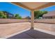 Large backyard with covered patio and empty space at 10419 E Kiva Ave, Mesa, AZ 85209