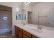 Bathroom with double vanity, large mirror and shower/tub combo at 10419 E Kiva Ave, Mesa, AZ 85209