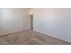 Well-lit bedroom with neutral walls and carpet at 10419 E Kiva Ave, Mesa, AZ 85209