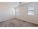 Simple bedroom with neutral walls and carpet at 10419 E Kiva Ave, Mesa, AZ 85209