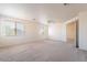 Spacious bedroom with two windows and ceiling fan at 10419 E Kiva Ave, Mesa, AZ 85209