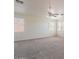 Large bedroom with three windows and ceiling fan at 10419 E Kiva Ave, Mesa, AZ 85209