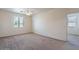 Spacious bedroom with carpeted floor, ceiling fan, and window blinds at 10419 E Kiva Ave, Mesa, AZ 85209