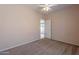Bright bedroom with carpet flooring and door to patio at 10419 E Kiva Ave, Mesa, AZ 85209