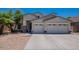 Two-story house with three-car garage and desert landscaping at 10419 E Kiva Ave, Mesa, AZ 85209