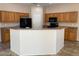 Spacious kitchen with ample cabinetry and an island at 10419 E Kiva Ave, Mesa, AZ 85209
