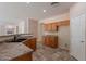 Kitchen boasts wood cabinets and a double sink at 10419 E Kiva Ave, Mesa, AZ 85209