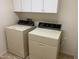 Laundry room with washer, dryer, and cabinets at 10419 E Kiva Ave, Mesa, AZ 85209