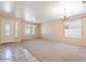 Bright living room with tile floors and neutral decor at 10419 E Kiva Ave, Mesa, AZ 85209