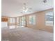 Open living room with kitchen views and access to backyard at 10419 E Kiva Ave, Mesa, AZ 85209