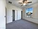 Bright bedroom with large window and carpet flooring at 11013 E Quarry Cir, Mesa, AZ 85212