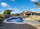 Inviting kidney-shaped pool with a pebble-tec finish in backyard at 11013 E Quarry Cir, Mesa, AZ 85212