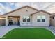 One-story house with covered patio and landscaped yard at 11828 W Donald Dr, Sun City, AZ 85373