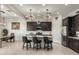 Modern kitchen with dark cabinetry and island at 12082 E Fossil Spgs, Gold Canyon, AZ 85118