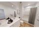 Bathroom with double vanity, soaking tub, and tiled shower at 12535 W Parkway Ln, Avondale, AZ 85323