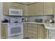 Modern kitchen with white appliances and granite countertops at 17200 W Bell Rd # 943, Surprise, AZ 85374