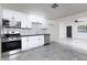 Updated kitchen featuring white cabinets and stainless steel appliances at 174 W 15Th Ave, Apache Junction, AZ 85120