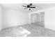 Bright living room featuring tile floors and a ceiling fan at 174 W 15Th Ave, Apache Junction, AZ 85120