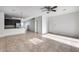 Bright and airy living room with tile floors and kitchen view at 17409 W Holland Ln, Surprise, AZ 85388