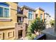 Tan colored multi-level building with balconies and lush landscaping at 18250 N Cave Creek Rd # 163, Phoenix, AZ 85032