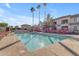 Community pool with lounge chairs and barbecue grills at 1941 S Pierpont Dr # 2061, Mesa, AZ 85206