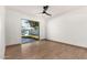 Spacious bedroom with light wood flooring and sliding glass door to backyard at 2154 W Edgewood Ave, Mesa, AZ 85202