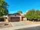 House exterior with brown garage door and landscaping at 216 W Atlantic Dr, Casa Grande, AZ 85122