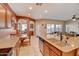 Kitchen with island, granite countertops, and wooden cabinets at 216 W Atlantic Dr, Casa Grande, AZ 85122